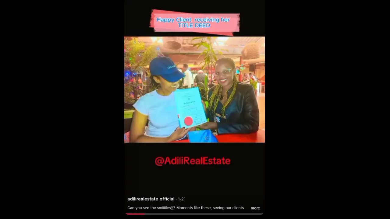 Client Receiving Their Title Deed